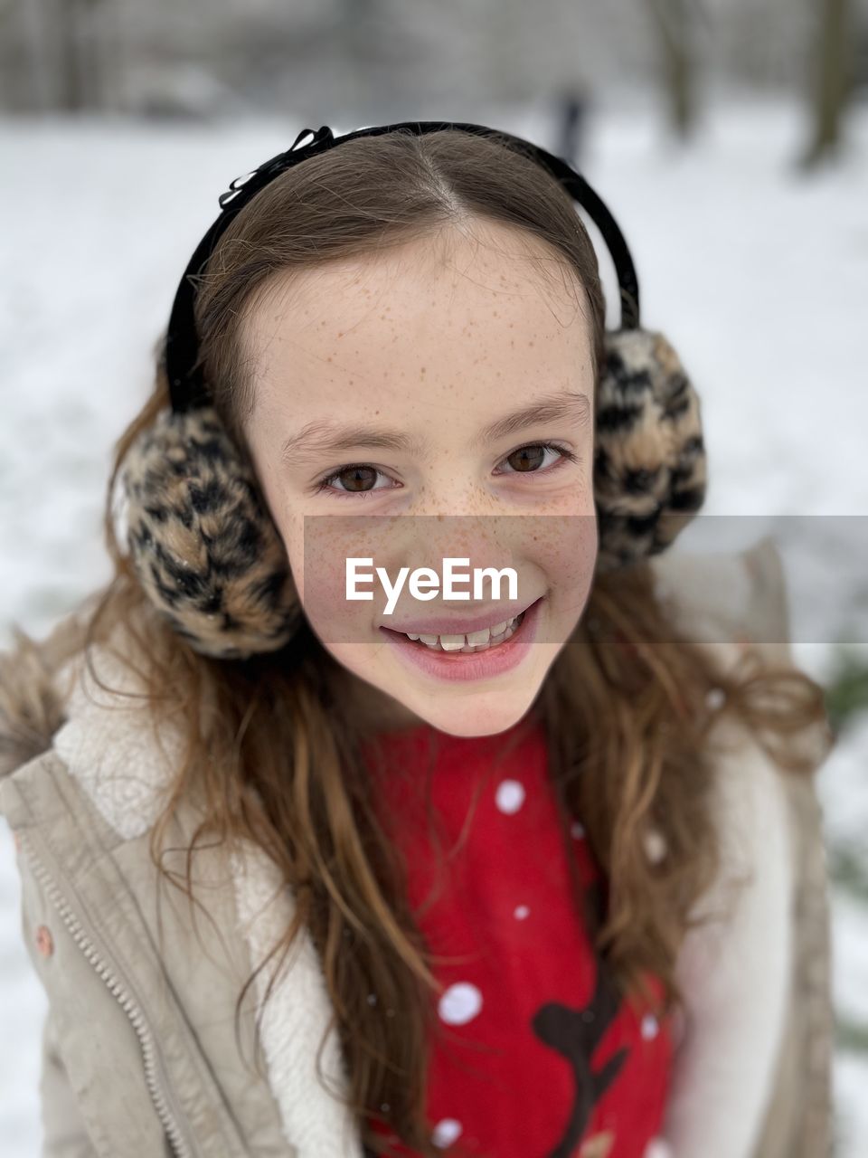 Portrait of cute smiling girl during winter