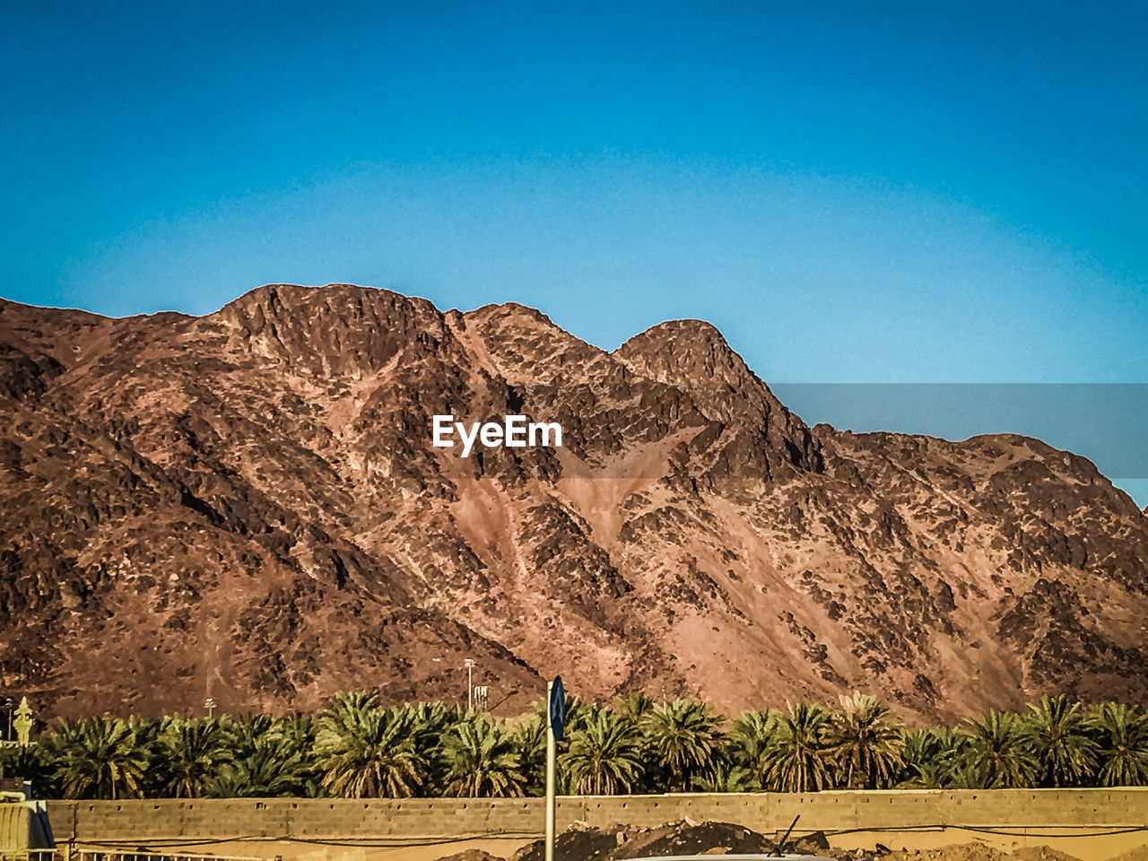 Scenic view of mount uhud against clear blue sky