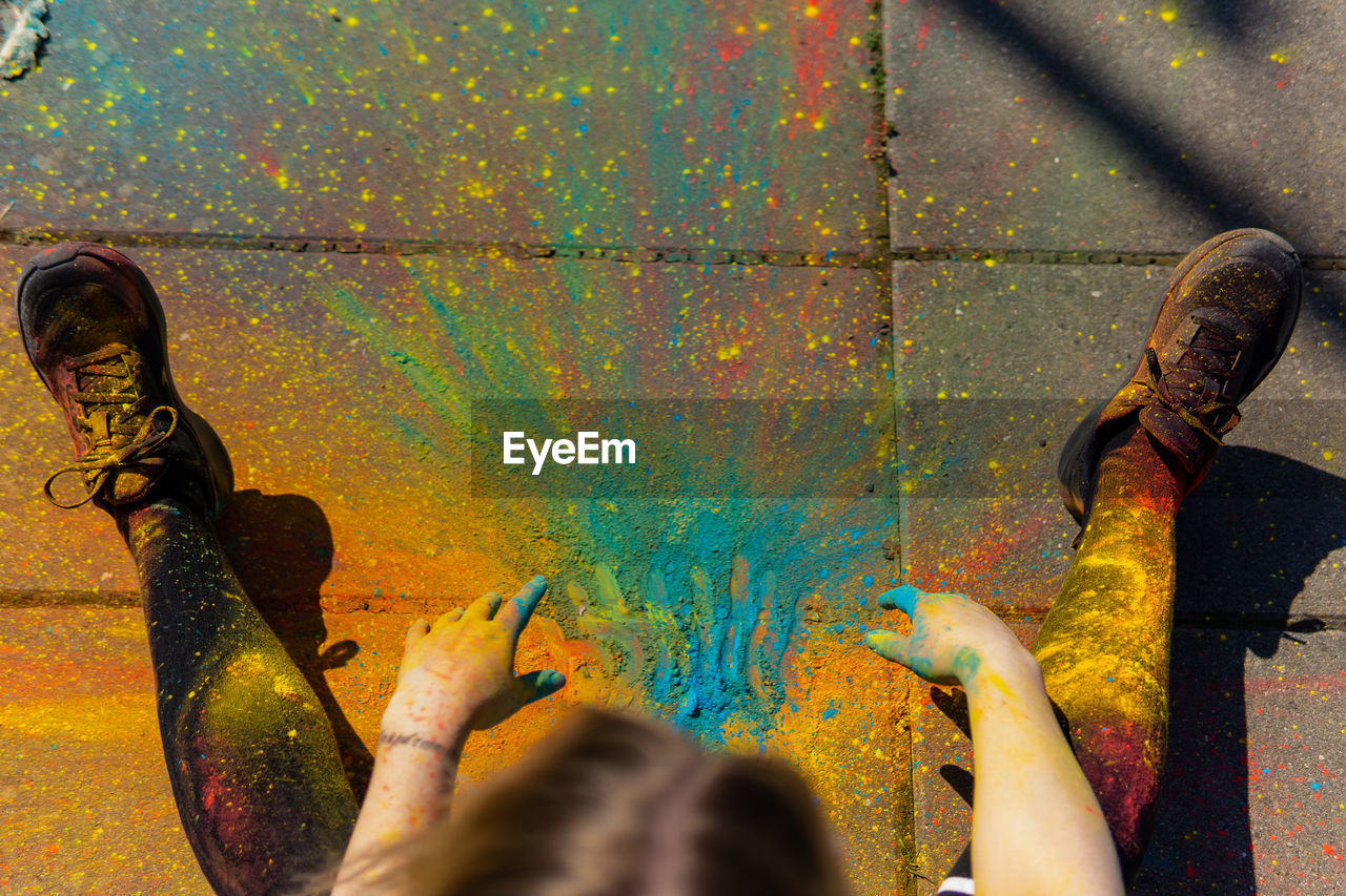 Low angle view of people hand on rusty metal