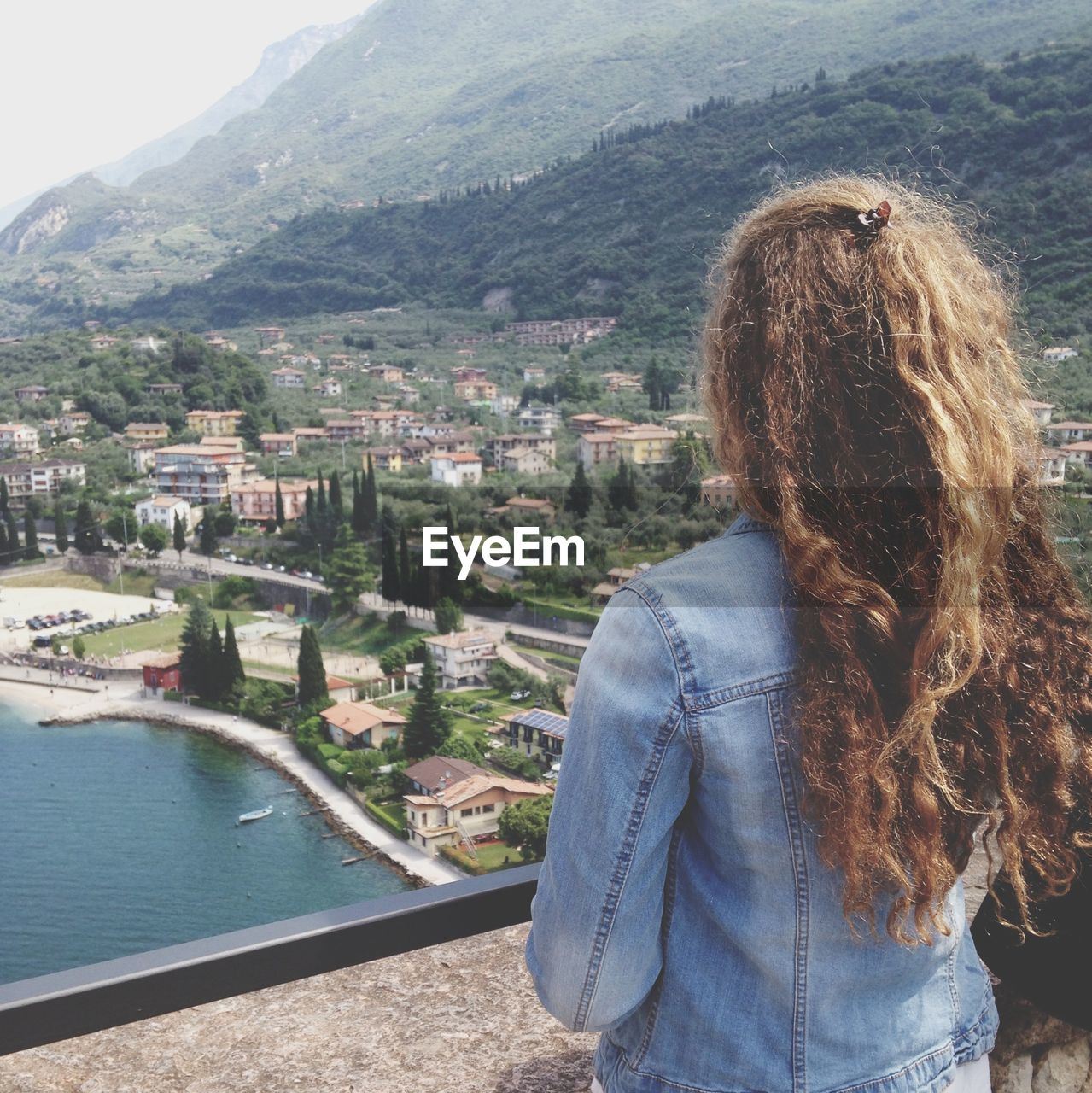 Woman with town in the background