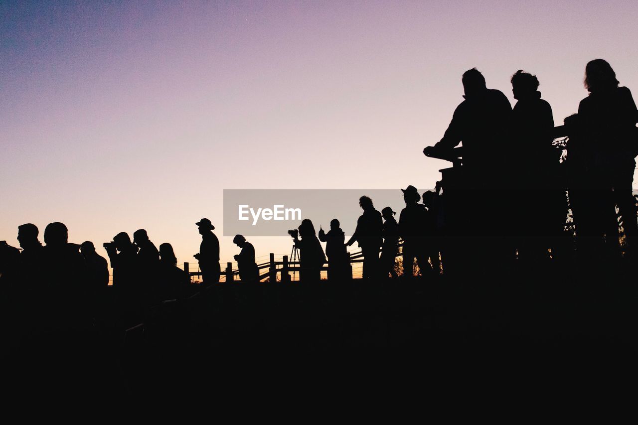 Silhouette people at sunset