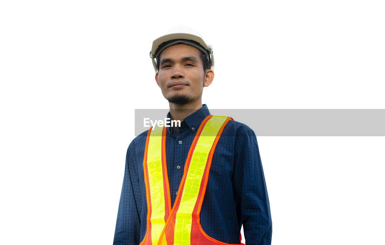 PORTRAIT OF MAN AGAINST WHITE BACKGROUND