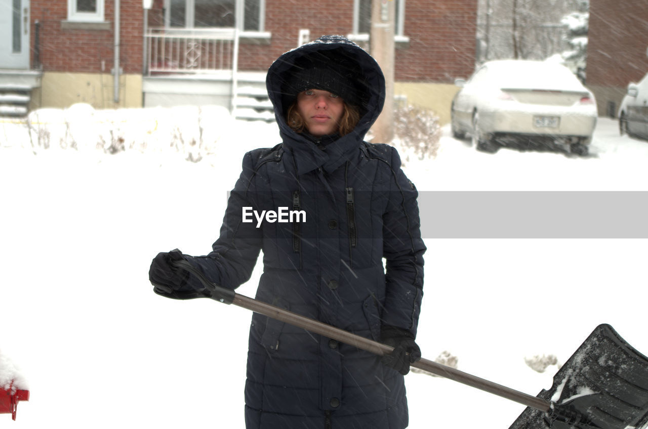 Woman standing in snow