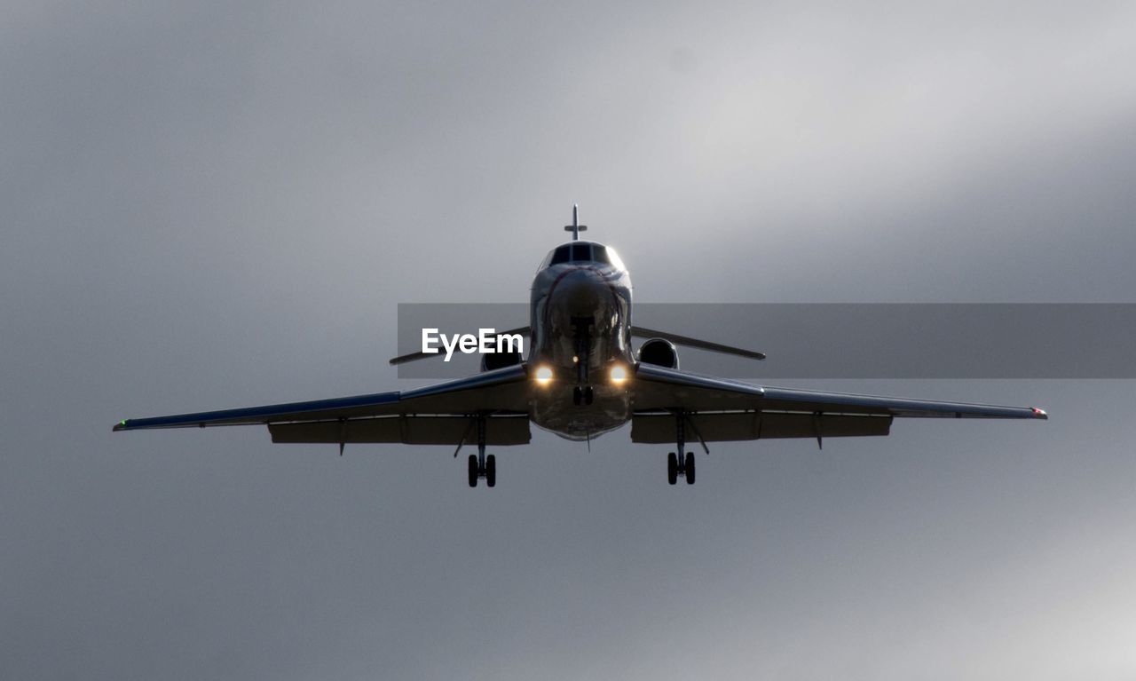 Low angle view of airplane flying in sky