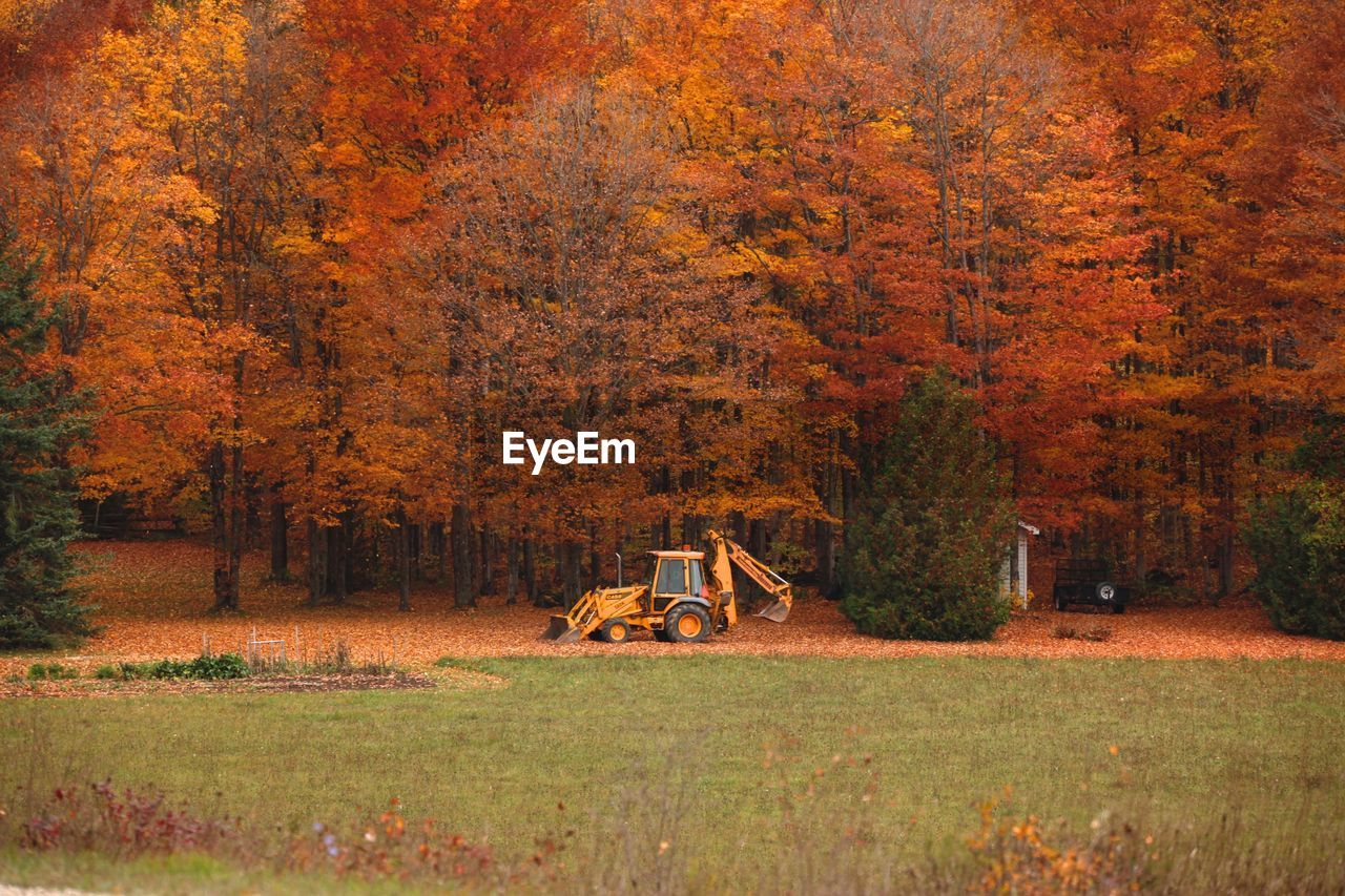 Mid distance of excavator on field during autumn