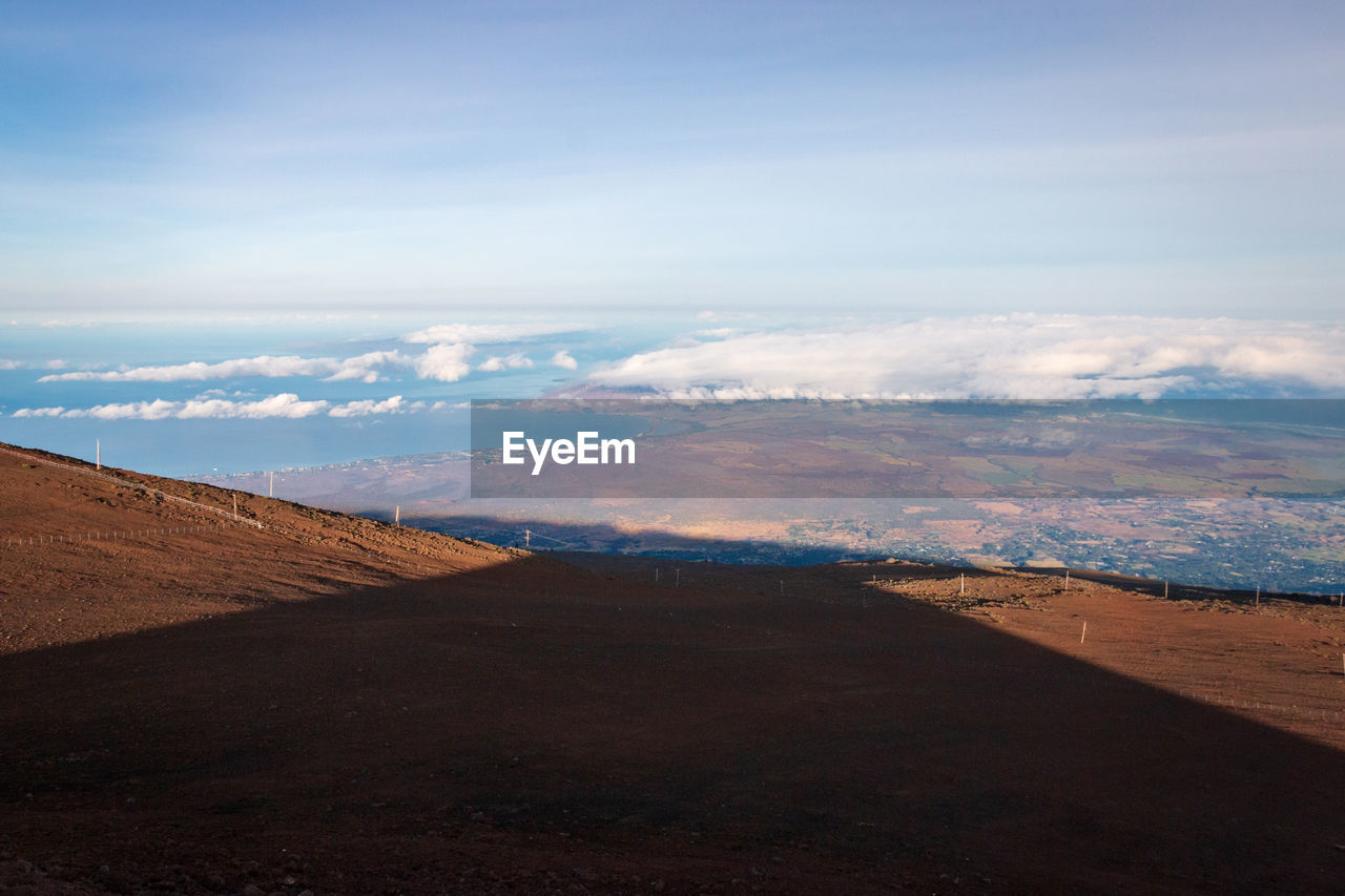 Conical shadow of haleakala volcano at sunrise on the hawaiian island of maui, usa against sky