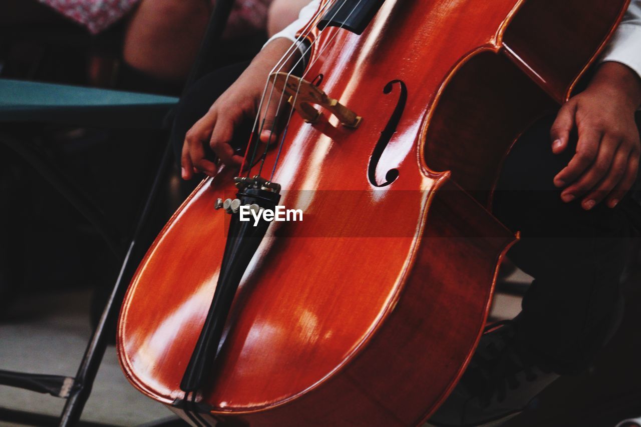 Low section of boy with cello