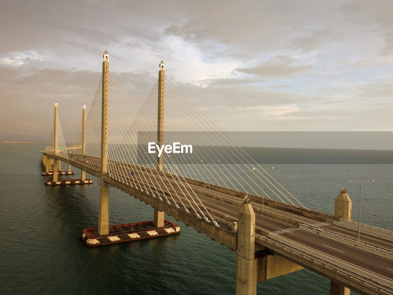 high angle view of suspension bridge over sea against sky