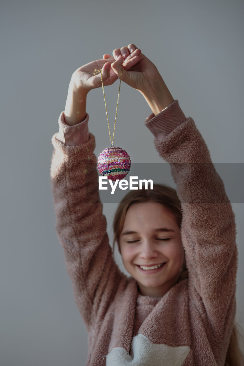 Girl holding christmas bauble