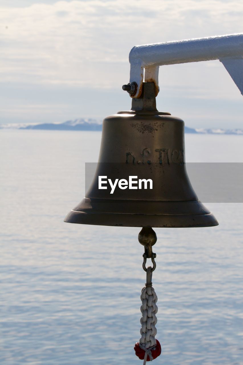 Ship's bell set against an arctic backdrop