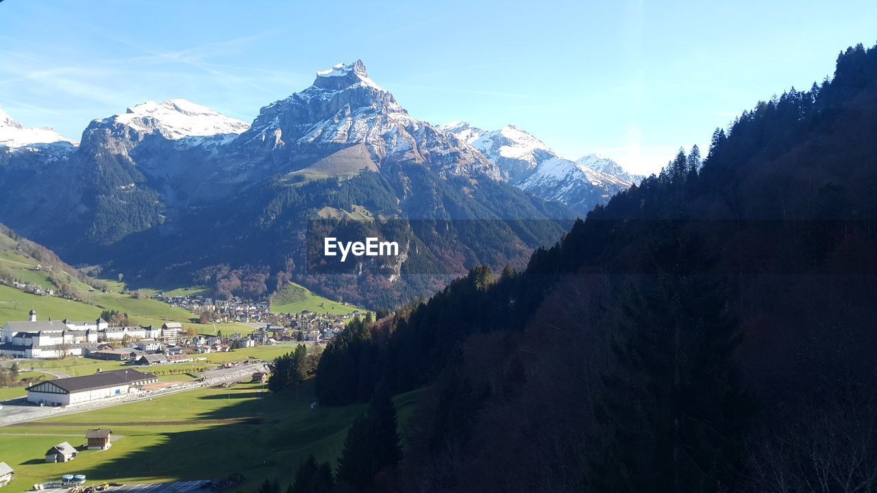 Scenic view of snowcapped mountains against sky