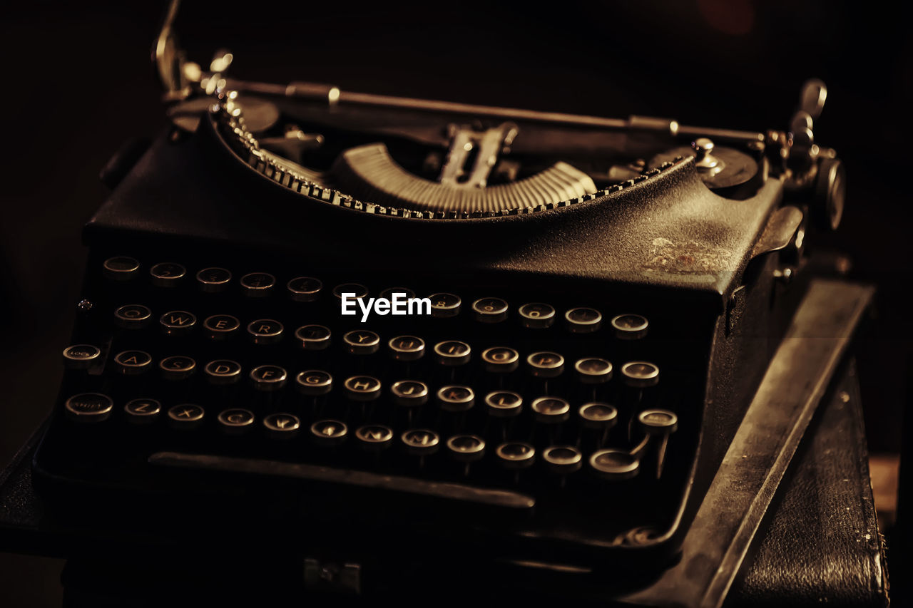 Close-up of old typewriter on table