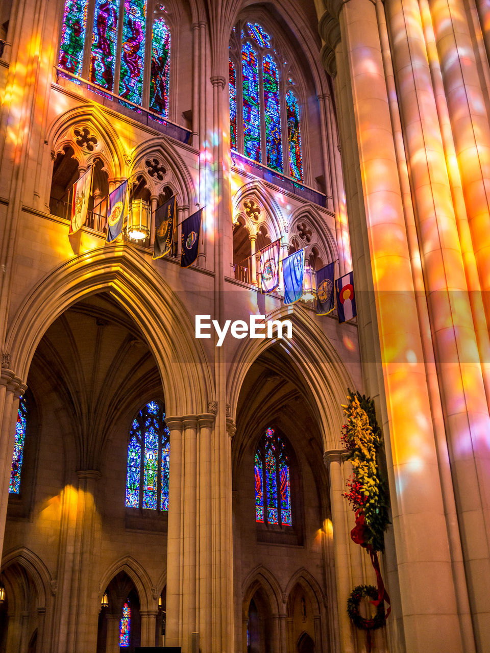 LOW ANGLE VIEW OF ILLUMINATED BUILDING INTERIOR