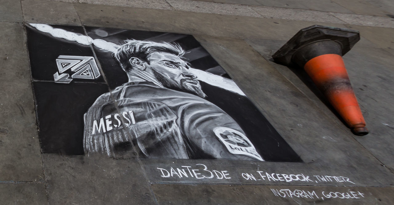 CLOSE-UP OF STATUE AGAINST WALL