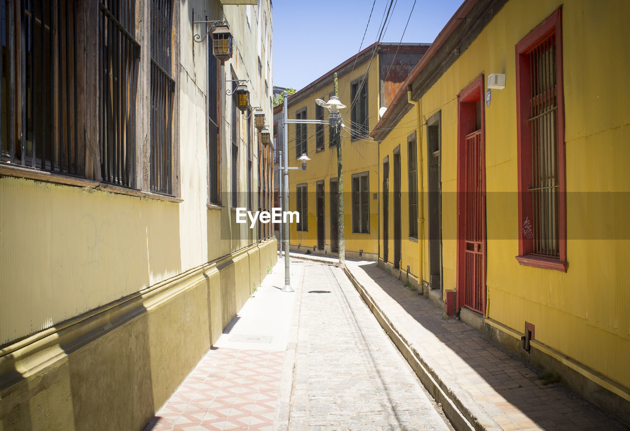 STREET AMIDST RESIDENTIAL BUILDINGS