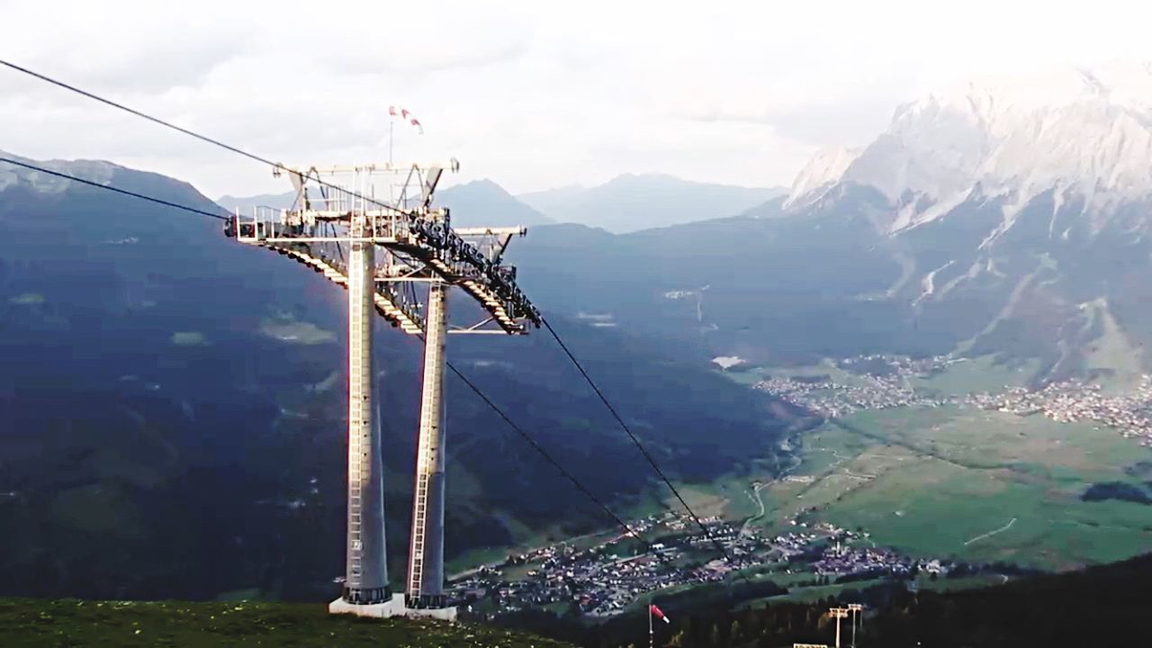 Overhead cable wire with mountain in background