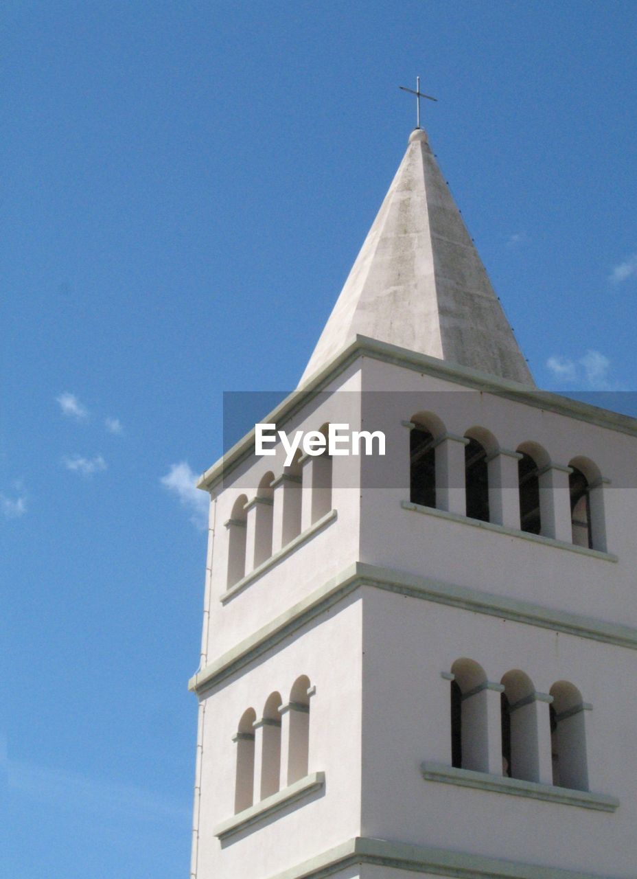 LOW ANGLE VIEW OF BELL AGAINST BLUE SKY