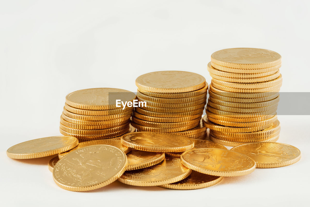 Close-up of coins against white background