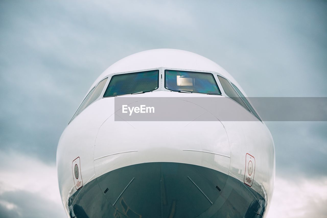 Close-up of airplane against sky