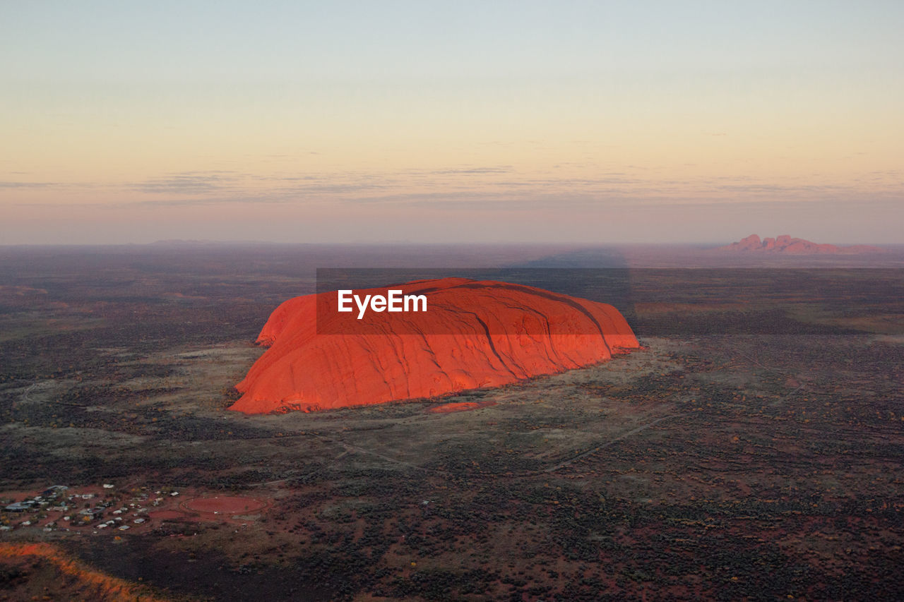 scenic view of landscape against clear sky during sunset