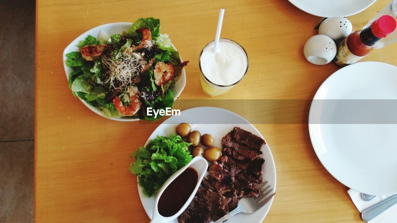 HIGH ANGLE VIEW OF FOOD SERVED ON TABLE