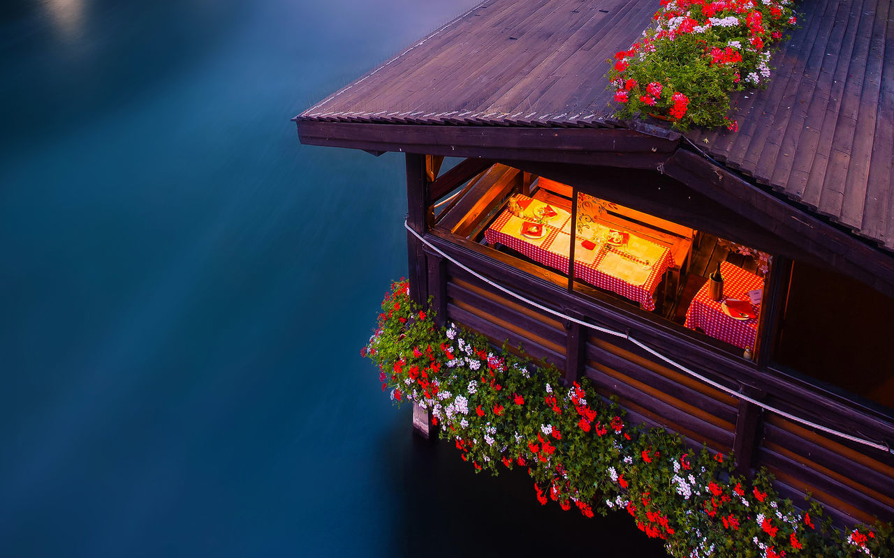 High angle view of cropped houseboat in calm lake