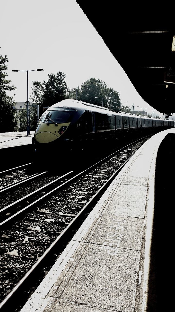 TRAIN ON RAILROAD TRACKS