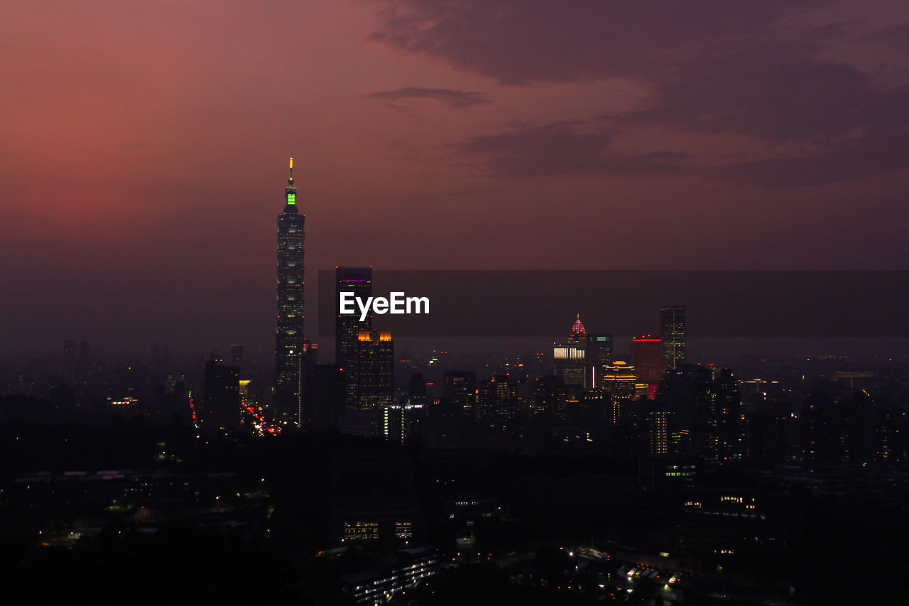 Illuminated buildings in city at night