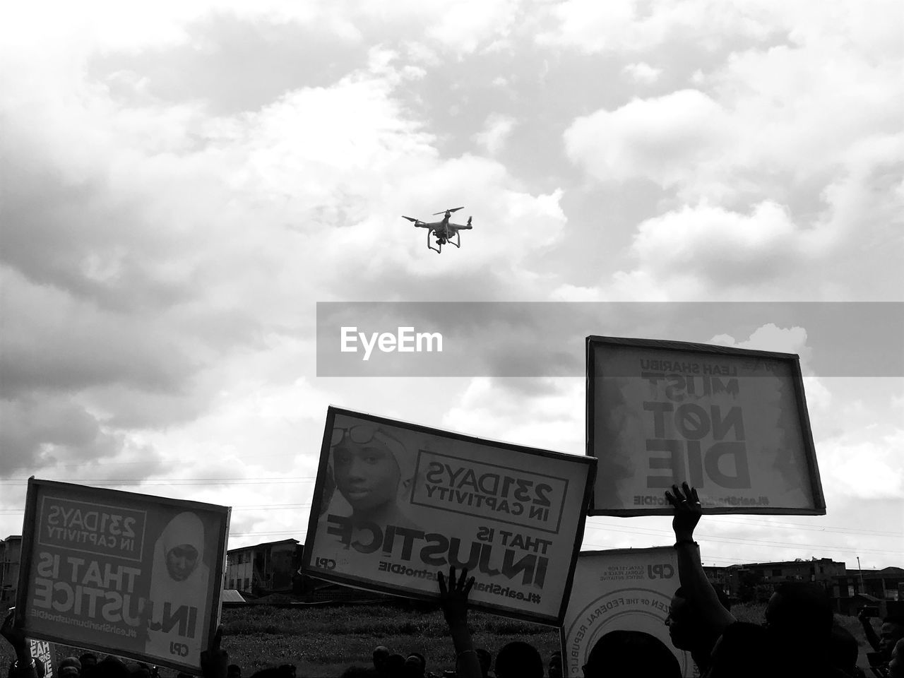 LOW ANGLE VIEW OF AIRPLANE SIGN AGAINST SKY