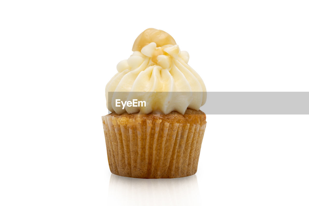 CLOSE-UP OF CUPCAKES ON WHITE BACKGROUND