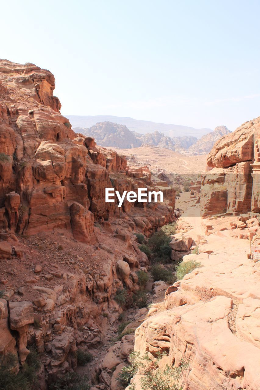 SCENIC VIEW OF MOUNTAINS AGAINST CLEAR SKY