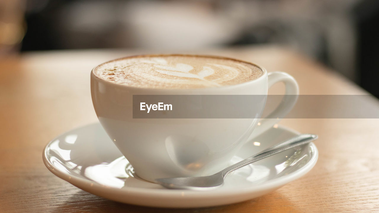 Close-up of cappuccino on table