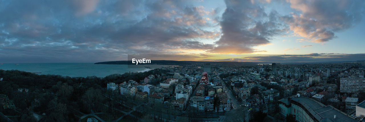 Aerial view of townscape against sky during sunset