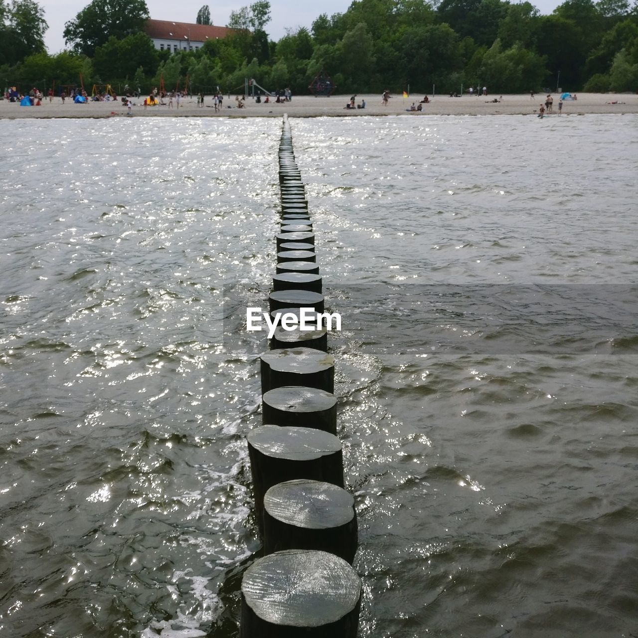 VIEW OF WOODEN BRIDGE IN WATER