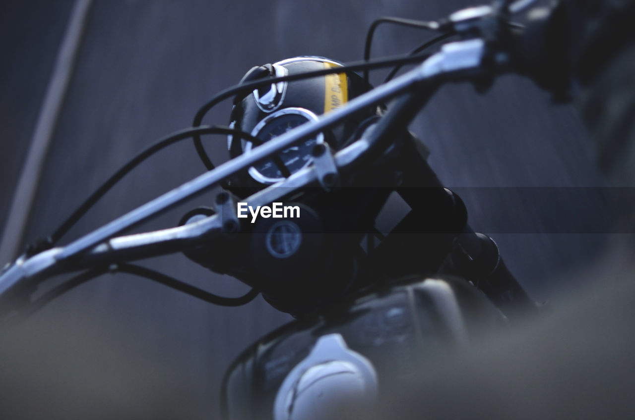 CLOSE-UP OF BICYCLE ON METAL