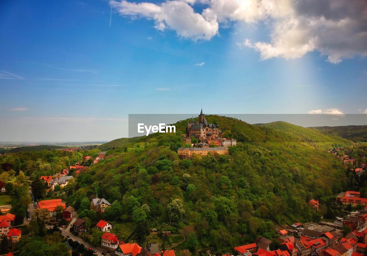 High angle view of trees and building against sky