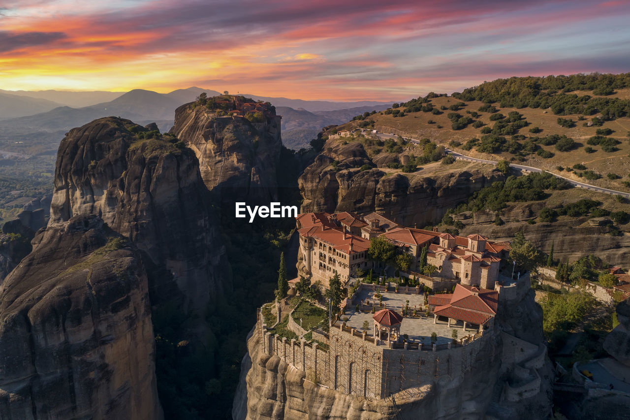 High angle view of buildings on mountain against sky during sunset