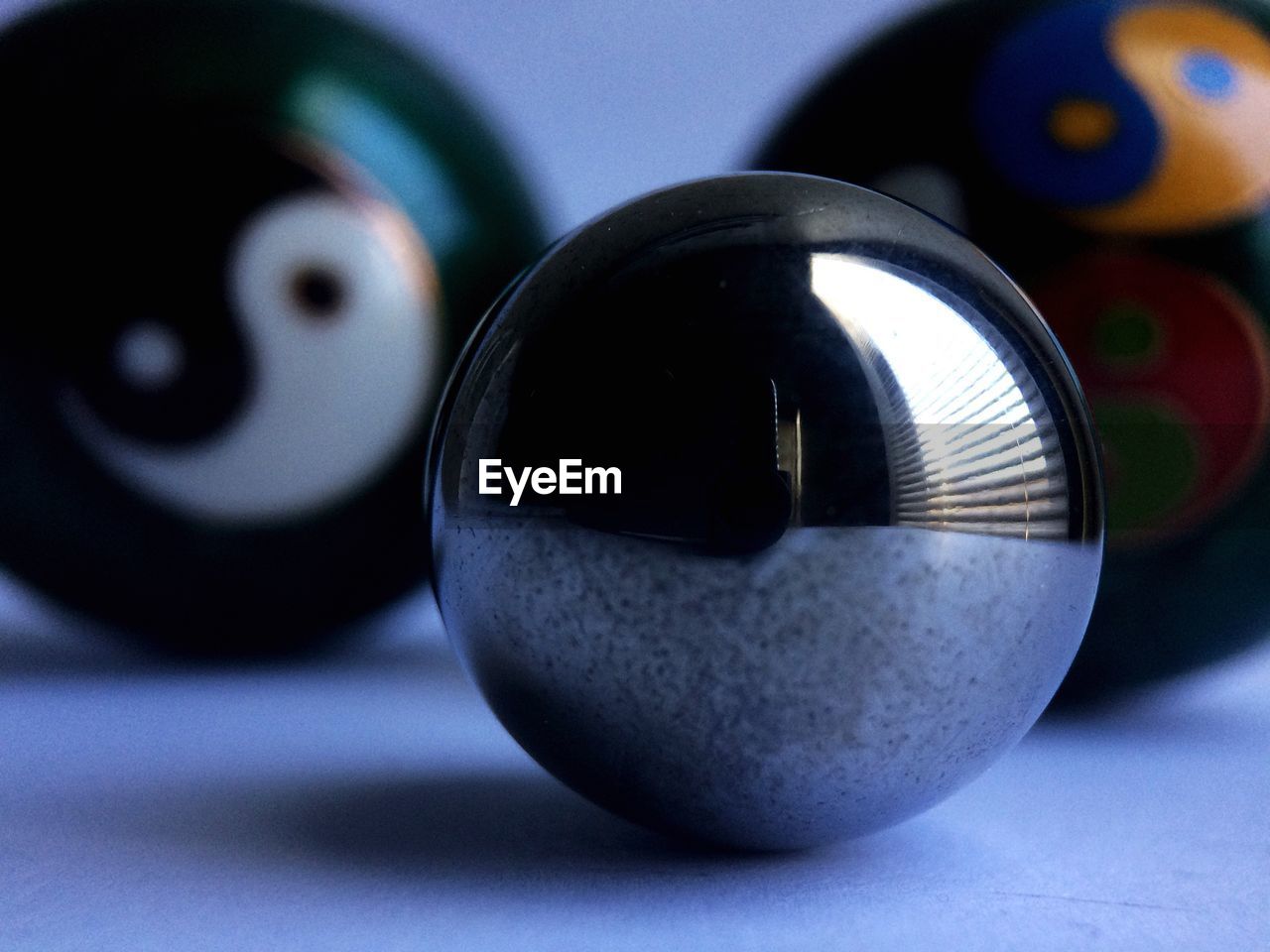 CLOSE-UP OF TEA LIGHT ON TABLE AT HOME