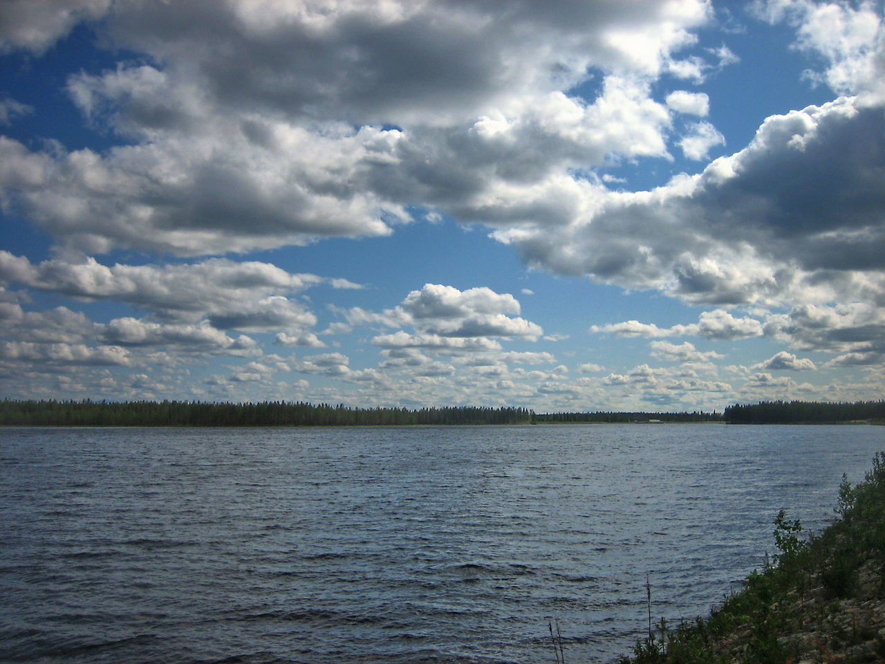 VIEW OF LAKE AGAINST CLOUDY SKY