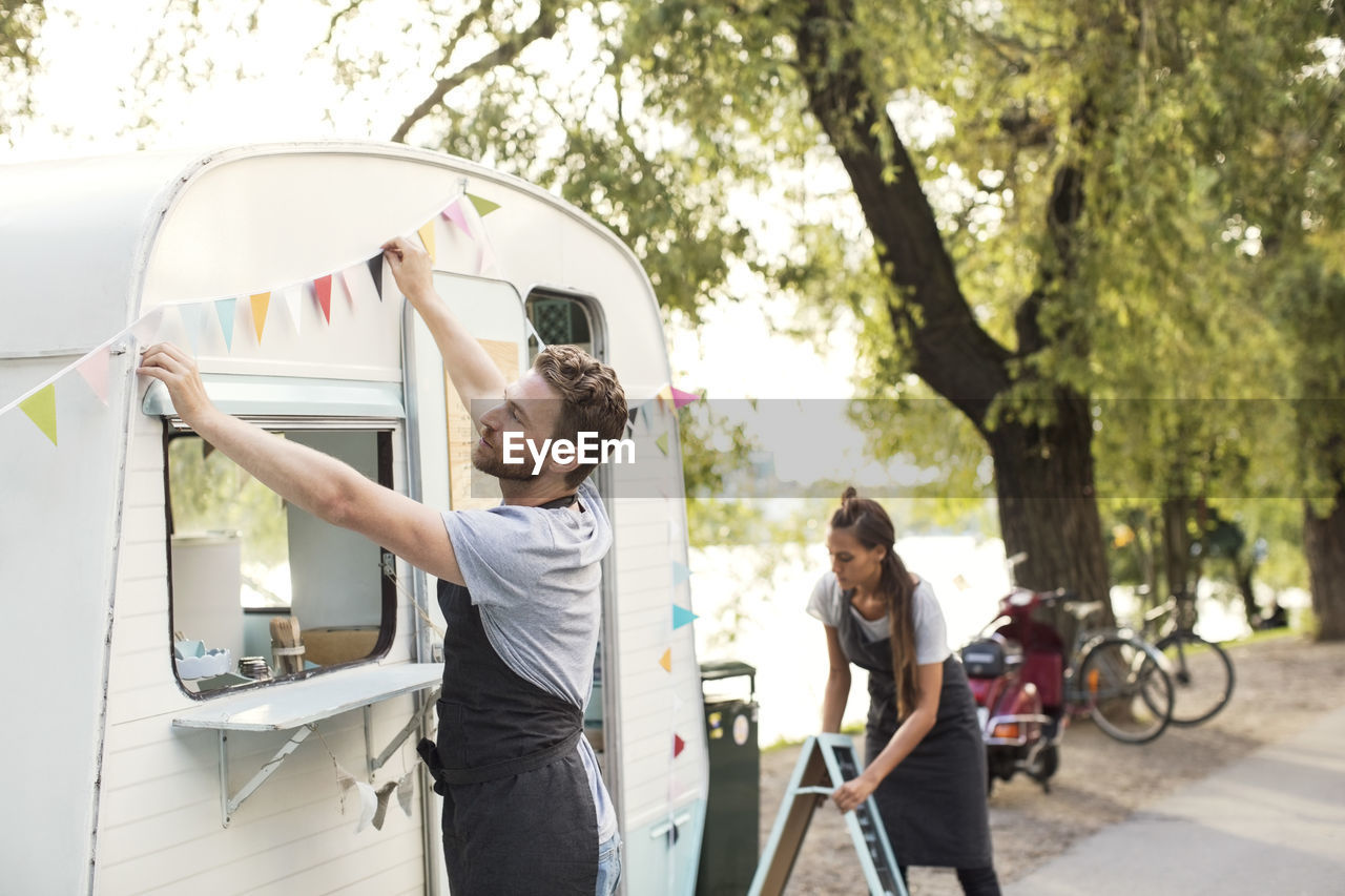 Owners working outside food truck on street