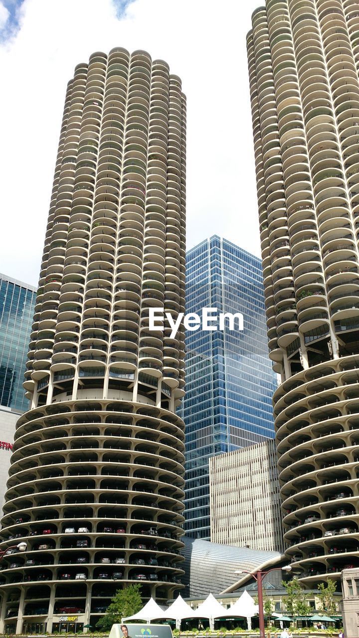 LOW ANGLE VIEW OF OFFICE BUILDINGS AGAINST SKY