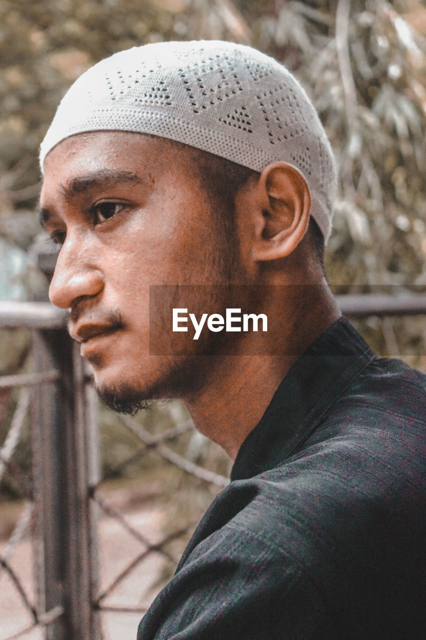 Close-up portrait of man looking away