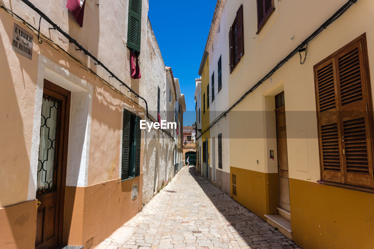 Narrow alley amidst buildings in city