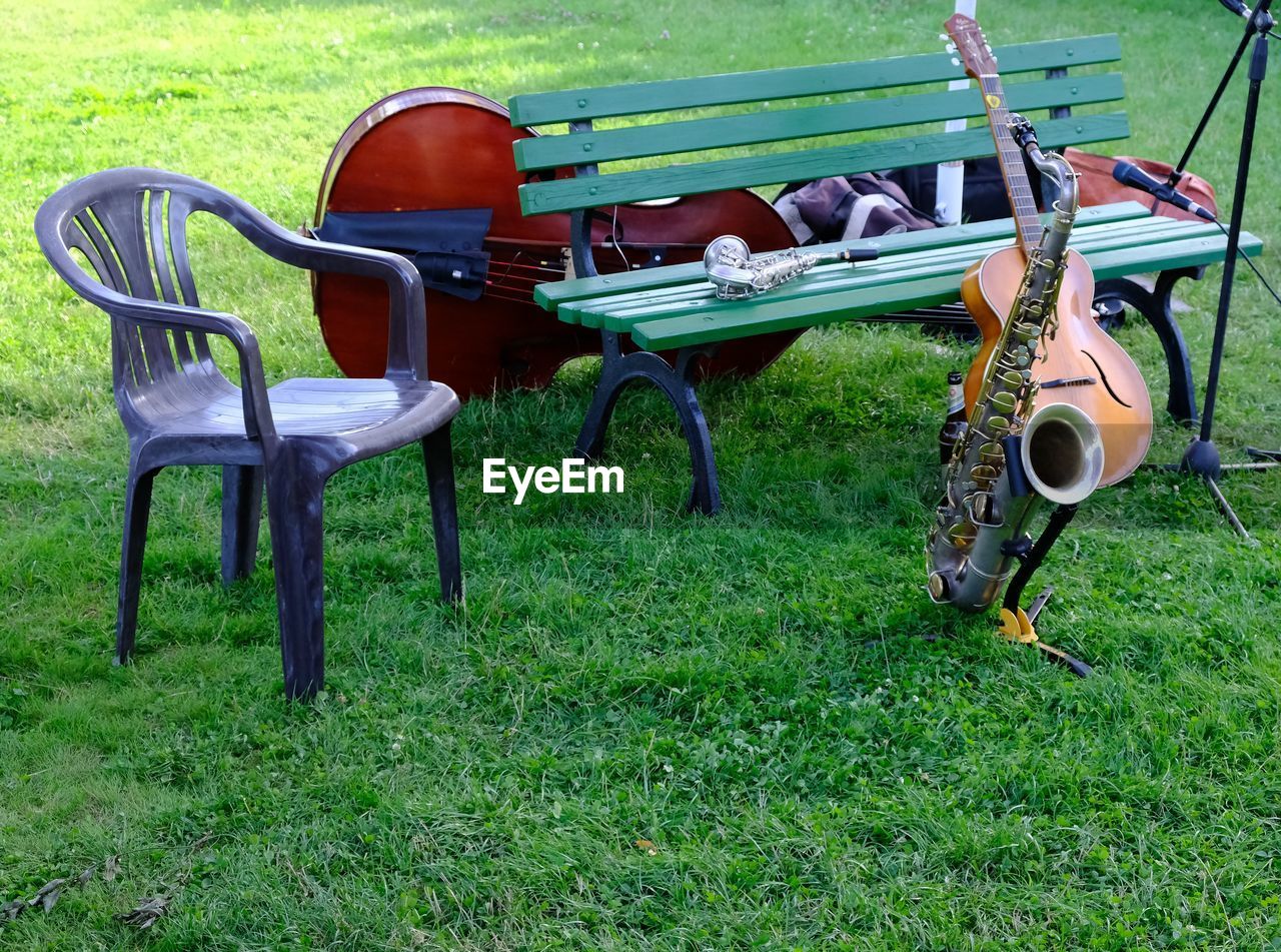 CHAIRS IN PARK AT FIELD