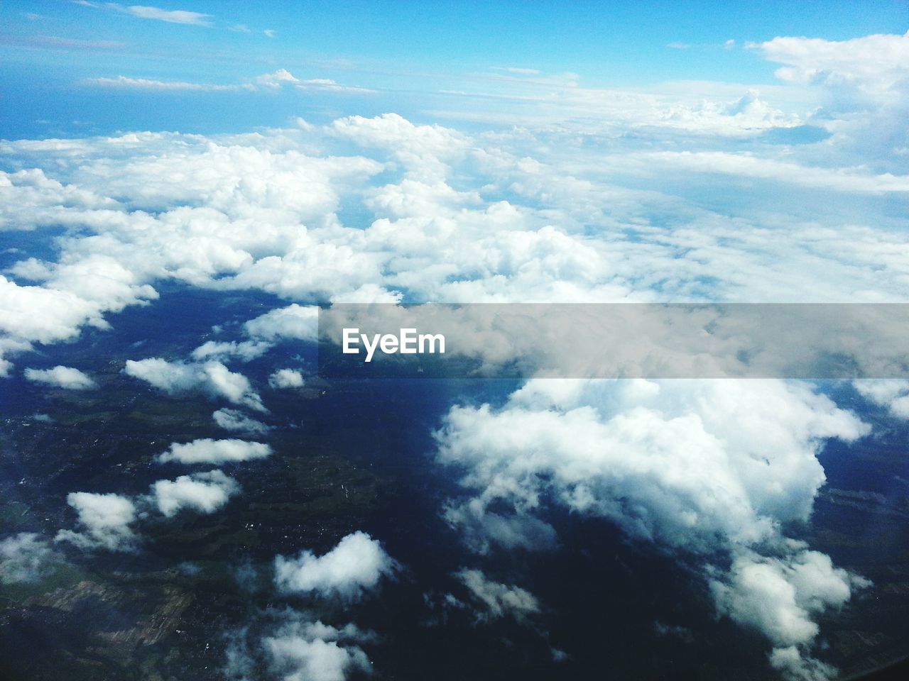 AERIAL VIEW OF CLOUDY SKY OVER LANDSCAPE