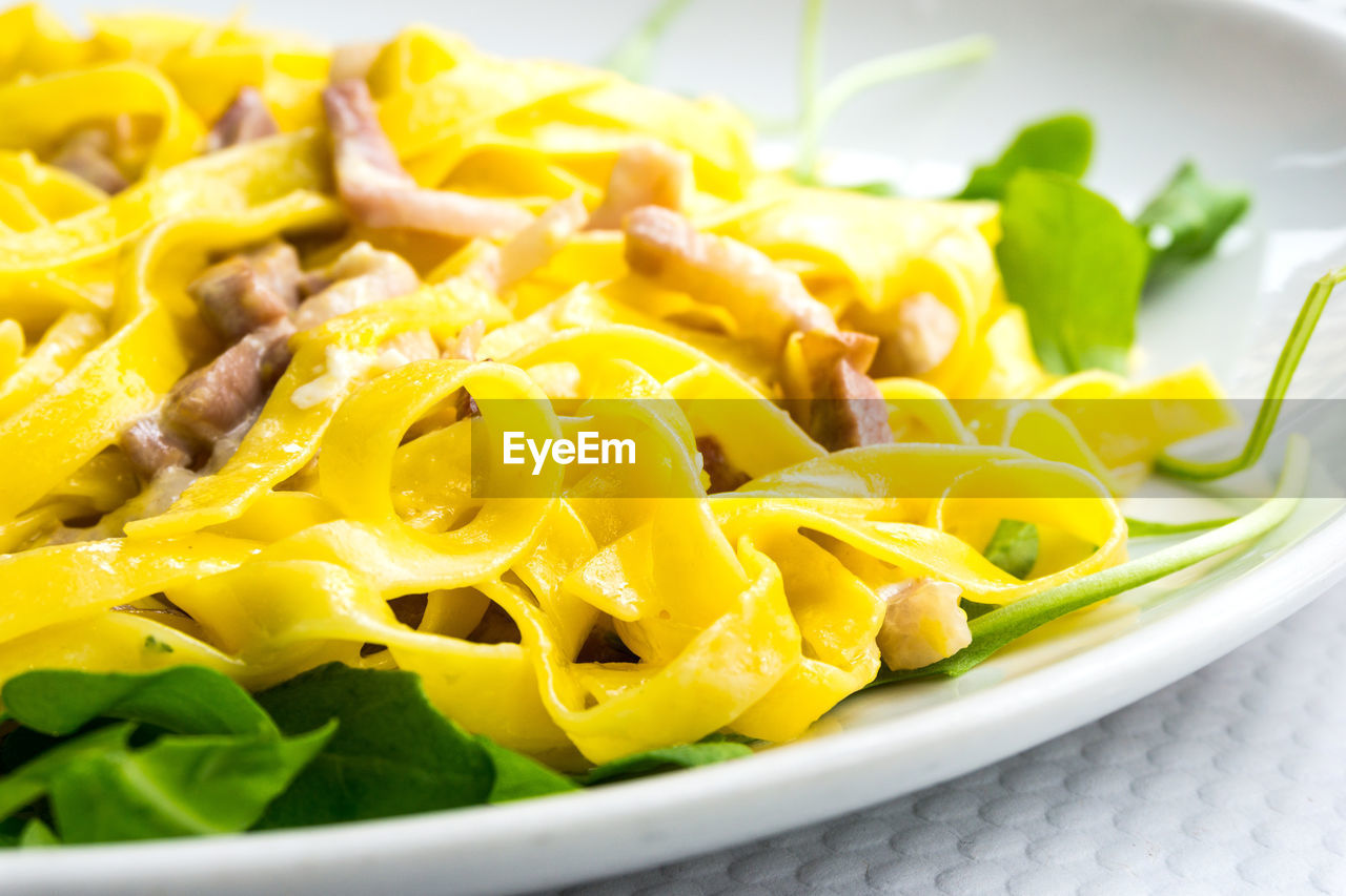 Close-up of tagliatelle pasta carbonara 