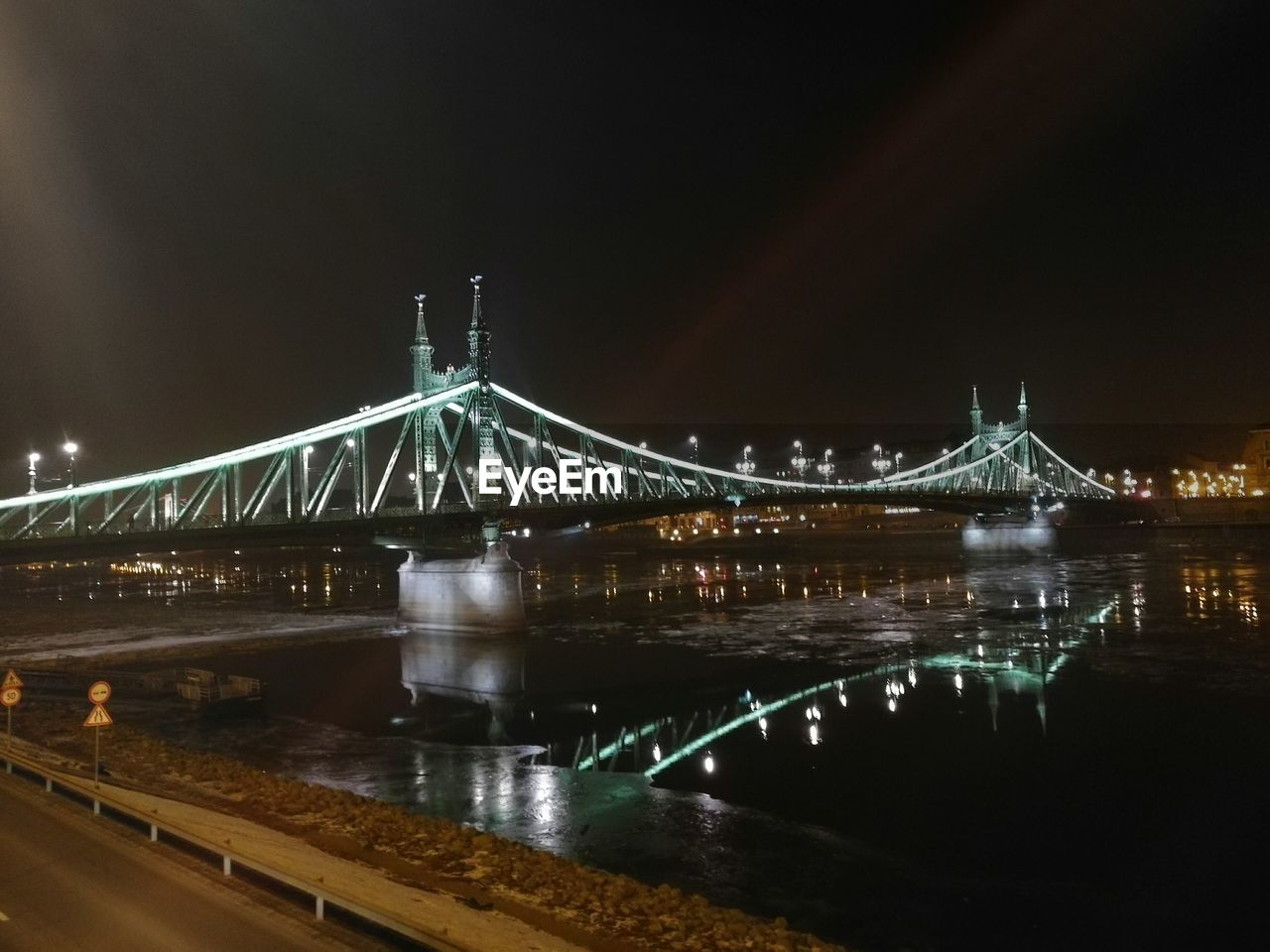 ILLUMINATED SUSPENSION BRIDGE AGAINST SKY