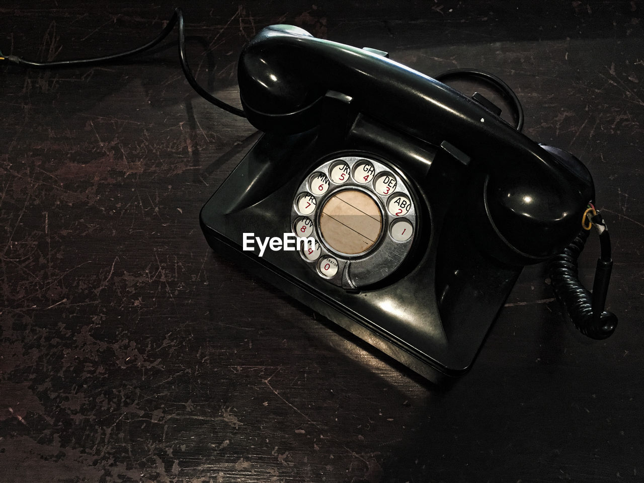High angle view of old telephone on table