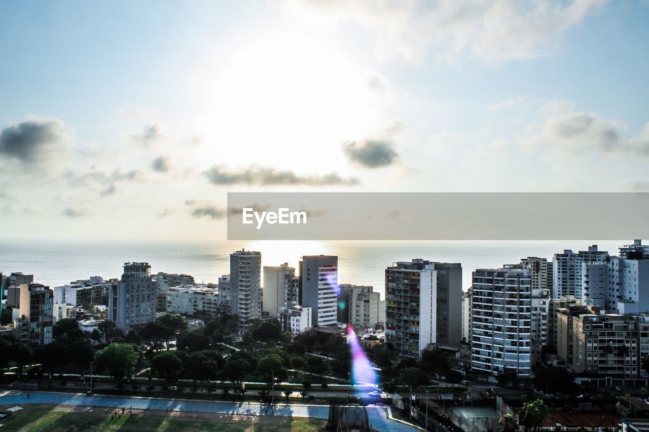 Modern buildings in city against sky