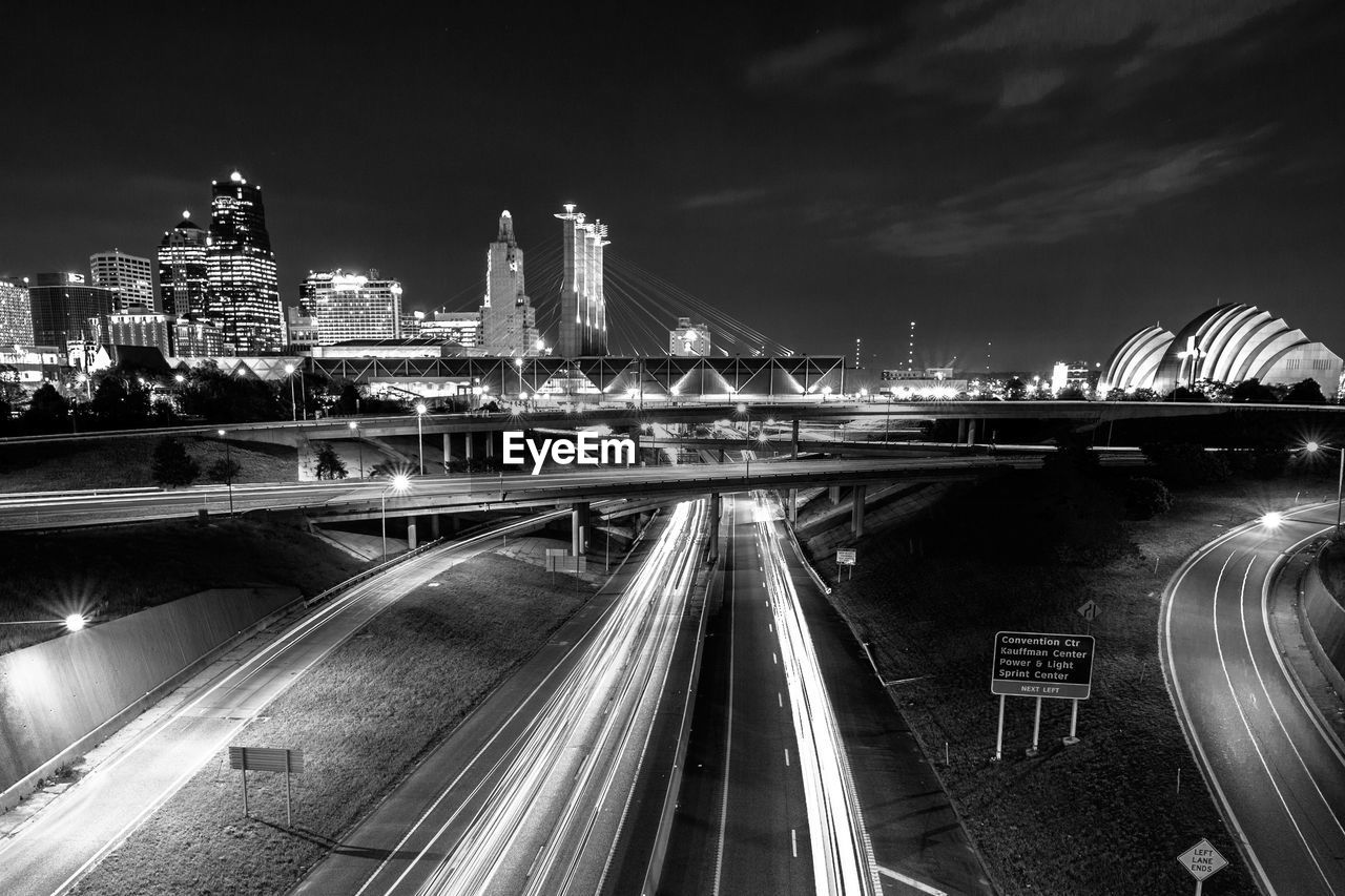 View of light streaks on roads in city at night